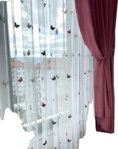 the curtains are open and ready to be hung in front of the window with butterflies on them