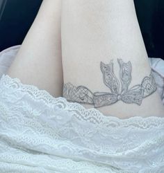 a close up of a person's legs with tattoos on them