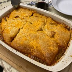 a casserole dish with meat and cheese in it