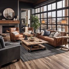 a living room filled with lots of furniture next to a fire place and large windows