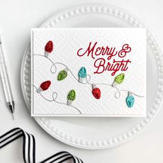 a white plate topped with a christmas card