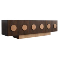 a wooden shelf with four circles on the front and one circle on the back side