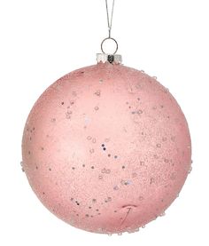 a pink ornament hanging on a white background