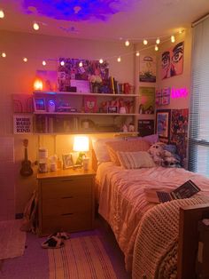 a bed room with a neatly made bed and lots of books on the shelf above it