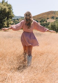 A classic boho mini dress in a mauve pink dot print. Dot print Relaxed fit Long sleeves Smocked elastic cuff Mini length V-neckline Decorative self-covered button front Elastic waist Side pockets Bohemian fall mini dress An ultra-flowy mini dress designed in a classic dot print. Featuring voluminous long sleeves, a flattering v-neckline, and essential side pockets. Effortlessly relaxed with feminine touches throughout, this fall mini dress can be easily dressed up or down. Model is 5'10, wearing Fall Mini Dress With Smocked Cuffs, Fall Mini Dress With Smocked Back And V-neck, Fall Mini Dress, Bohemian Fall, Bohemian Dresses, Pink Dot, Flowy Mini Dress, Fall Mini, Boho Mini Dress