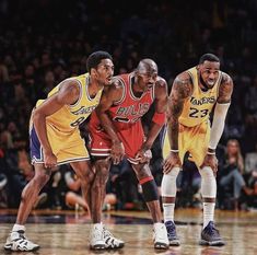 three basketball players are standing on the court