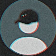 a black hat is sitting on top of a circular object with blue and red circles around it