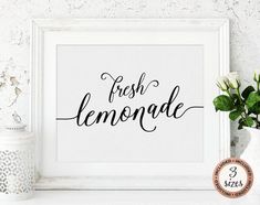 a white frame with the words fresh lemonade in cursive font on it