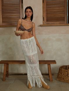 Editor's NotesThe Fringe-Hippy Long Skirt is a hippy-looking knit long skirt adding fringes on a diverse weave design, which you can wear as a cover-up. It can be worn freely with a knit strap on the waist, and with a relaxed fit, you can wear it from XS to L.- Maxi length- Fringe detail- Daily wear- A all-round item that is also good for styling with blouses or shirts for dress-up Measurements(in.)Size: One Size(XS-L)- Total Length: 36.61in. (Fringe Length 9.44in. / Skirt Length 27.16in.)- Waist: 18.11in.- Hem: 21.25in.Model Info: Height 5' 8, Bust 32in., Waist 23in., Hips 34.5in.                Composition & Care- Fabric: 100% Acrylic- Dry clean- Hand wash cold- Do not machine dry- Do not bleach- Do not warm iron Designer- b Bohemian Fringe Bottoms For Vacation, Fringe Beach Cover-up Bottoms, Bohemian Fringe Skirt For Vacation, Bohemian Long Skirt With Tassels For Summer, Beachwear Fringe Bottoms For Vacation, Beachwear Bottoms With Fringe For Vacation, Spring Fringe Beachwear Skirt, Fringe Beachwear Skirt For Spring, Summer Fringe Maxi Skirt