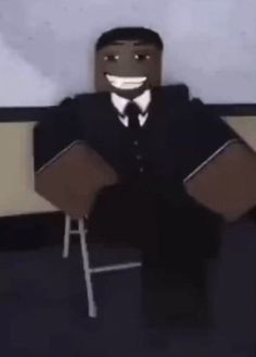 a man in a suit and tie sitting on a chair