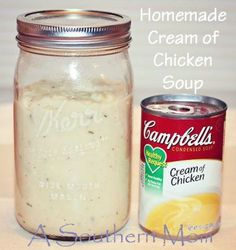 a glass jar filled with cream next to a can of chicken soup on a table