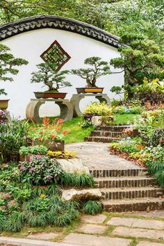 an outdoor garden with steps leading up to it