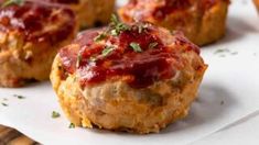 mini meatloaf muffins with ketchup and parsley on top