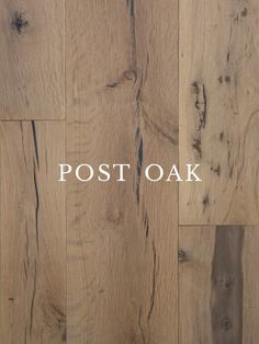 the words post oak are written in white ink on wood flooring that looks like planks