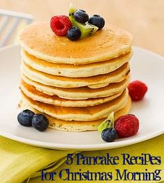 a stack of pancakes sitting on top of a white plate