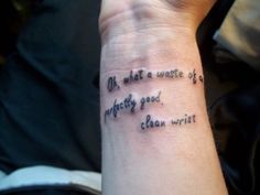 a woman's wrist tattoo with words written in cursive writing on it