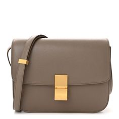 This is an authentic CELINE Liege Calfskin Medium Classic Box Flap Bag in Souris. This super-chic shoulder bag is crafted of fine textured calfskin leather in taupe and features an adjustable leather shoulder strap and a frontal matte gold press lock. This opens the flap to a partitioned matte leather interior with a zipper compartment and patch pockets. Luxury Taupe Rectangular Shoulder Bag, Designer Taupe Shoulder Bag For Formal Occasions, Celine Box Bag, Celine Box, Celine Bag, Box Bag, Medium Bags, Flap Bag, Matte Gold