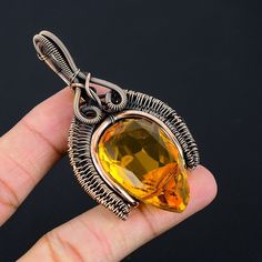 Handmade Copper Chain Size 18-20Inch - https://www.etsy.com/in-en/listing/1162990726 Welcome to our little shop, where you can find handmade copper wire jewelry and more, for you and your loved ones. We do accept custom orders also, kindly message us for more. Citrine Pendant Copper Wire Wrapped Pendant Citrine Gemstone Pendant Copper Jewelry Handmade Pendant Citrine Jewelry Gift For Her Mother Gemstone : Citrine  Pendant length : 7.5 Cm Metal : Copper  * Protection:- Copper will be tarnished after a while so try to limit contact with lotions, soaps or anything moist and never wear it in the shower, swimming or anywhere else it may come in contact with water. If tarnish becomes an issue, you may clean this item with jewelry cleaning cloth or ultra polishing pads. * Packing:- Your jewelry a Handmade Yellow Copper Jewelry, Bohemian Jewelry For Halloween Gift, Handmade Orange Citrine Jewelry, Handmade Amber Crystal Necklace Gift, Handmade Amber Crystal Necklace For Gift, Handmade Jewelry For Halloween Gift, Handmade Jewelry Gift For Halloween, Hand Wrapped Orange Jewelry Gift, Hand Wrapped Orange Jewelry For Gift