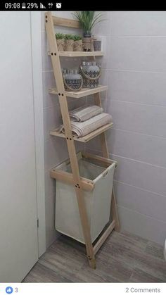 a ladder shelf with baskets and flowers in it