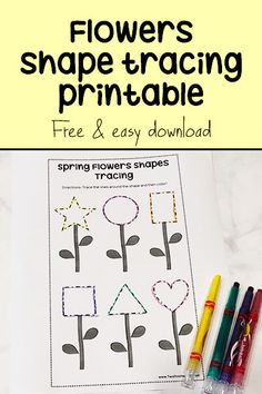 flowers shape and trace printable worksheet with crayons on the table