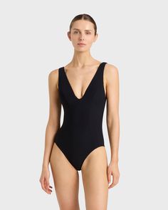 The Vida One Piece in Black is a flattering plunge V neck swimsuit, crafted from our Sculpteur® fabric, which supports and shapes the bust. Vida features wide, comfortable shoulder straps and flattering side panels which help define the silhouette. Vida features regular bottom coverage is suitable for large busts up to cup size DD. Fabric sustainably made in Italy.Garment sustainably made in Australia. Dd Cup, Luxury Swimwear, Deep Plunge, Black One Piece, Designer Swimwear, Shop Swimwear, Cup Size, Large Bust, Side Panels