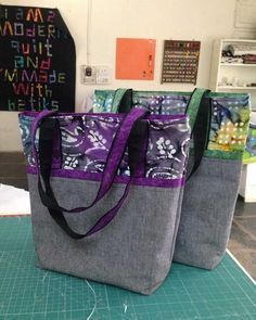 two bags sitting on top of a cutting board with the words, the world's fastest tote bag