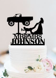 a wedding cake topper with a silhouette of a bride and groom