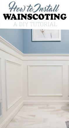 a bathroom with blue walls and white wainscoting on the wall is shown