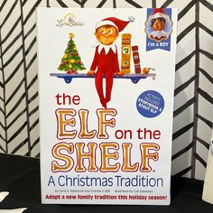 the elf on the shelf book is sitting on a table