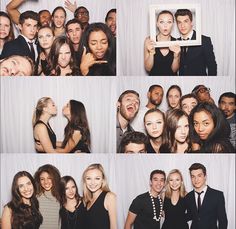 a group of people standing next to each other in front of a photo booth with white backdrop