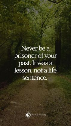 a path in the woods with a quote on it saying never be a prisoner of your past