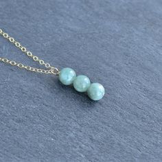 Dainty 6mm Jade bead pendant is very cute and subtle. Perfect little touch to add to any outfit. Jade has many benefits! - A stone of good luck and fortune - Soothing and calming stone that promotes harmony and balance in friendships, family and work. - Promotes confidence and self sufficiency - Releases negative energy and promotes emotional and spiritual healing. Minimalist 8mm Beads Necklace As Gift, Floating Pearl Necklace, Single Pearl Necklace, Pendant Minimalist, Hawaiian Jewelry, Pearl Bangle, Jade Earrings, Bead Pendant, Cluster Necklace