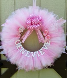 a pink tutule wreath with the word given written on it