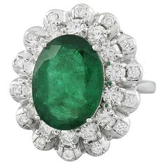 Stamped: 14K Total Ring Weight: 7.9 Grams Emerald Weight 6.88 Carat (14.00x10.50 Millimeters)Diamond Weight: 1.32 carat (F-G Color, VS2-SI1 Clarity )Face Measures: 23.40x19.75 Millimeter SKU: [600787] Platinum Oval Emerald Ring With 17 Jewels, Oval Platinum Emerald Ring With 17 Jewels, Dazzling Oval Emerald Ring In Platinum, Luxury Pear-shaped Emerald Ring For Formal Occasions, Formal Gia Certified Cluster Ring, Gia Certified Oval Emerald Cluster Ring, Formal Pear-shaped Emerald Ring In White Gold, Luxury Oval Emerald Cluster Ring, Formal Cluster Emerald Ring In White Gold