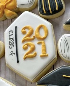 decorated cookies with graduation caps and numbers on them