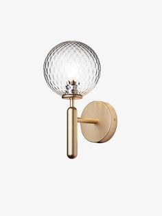 a wall light with a glass ball on it