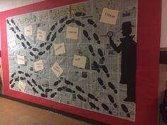 a bulletin board that has been decorated with people and words on it in the middle of a hallway