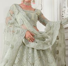 Dusty Mint Green Designer Heavy Embroidered Bridal Lehenga-Saira's Boutique Fitted Choli With Intricate Embroidery For Eid, Fitted Saree Set With Intricate Embroidery, Fitted Embroidered Fabric With Sheer Dupatta For Eid, Pista Green Embroidered Anarkali Fabric, Fitted Pista Green Anarkali Set With Intricate Embroidery, Fitted Pista Green Sets In Traditional Drape, Fitted Pista Green Sets With Traditional Drape, Fitted Pista Green Fabric With Resham Embroidery, Fitted Embroidered Fabric With Traditional Drape