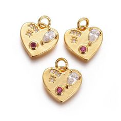 1 - Gold Heart with Gems Charm * Gold plated brass * Red and clear gems * Jewelry Making Supplies * Cubic Zirconia pendant * Size: about 12.5mm wide, 12.5mm long, 3mm thick, hole: 3mm. * Color: Gold * Quantity: 1 ❤ Create Something Lovely! Dangling Pendant Charms For Valentine's Day, Valentine's Day Pendant Charms With Dangling Details, Valentine's Day Dangling Charms Pendant, Valentine's Day Heart-shaped Dangling Charms, Heart-shaped Gold Plated Charms For Gifts, Rose Gold Charms For Valentine's Day, Rose Gold Heart Charms For Valentine's Day, Valentine's Day Heart Pendant Dangling Charms, Heart Pendant Charms For Jewelry Making