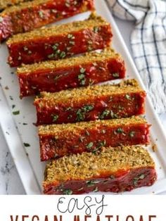 slices of meatloaf on a white plate with parsley sprinkled on top