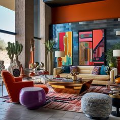 a living room filled with lots of furniture and colorful paintings on the wall behind it