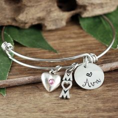 Take a LOOK at our Website: ANNIEREH.com Looking for that perfect gift for Mom? See our personalized Custom Mom Bracelet with her children's Names. Details for Bracelet: * Stainless Steel Bangle * Pewter Heart with Birthstone for MOM * MOM Pendant * ONE Name added to represent each Child. More names can be added during check out. (price will adjust automatically) How to order: 1. Select the number of names (let us know the name in the note to seller box) at check out Thank you for shopping! Anni Adjustable Engraved Heart Bracelet Gift, Engraved Heart Bracelet As Gift, Engraved Round Heart Bracelet As Gift, Personalized Charm Bangle Bracelet For Mother's Day, Personalized Bangle Charm Bracelet For Mother's Day, Mother's Day Personalized Charm Bangle Bracelet, Anniversary Charm Bangle Bracelet For Valentine's Day, Personalized Mother's Day Bangle Charm Bracelet, Anniversary Bangle Charm Bracelet For Valentine's Day