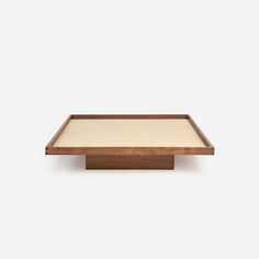 a wooden table with a white background