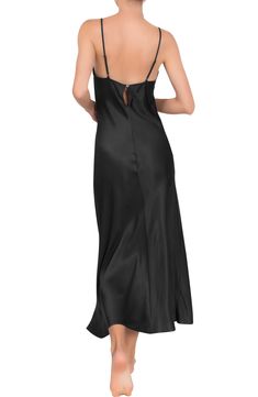 Fall in love with this smooth, satiny nightgown designed in a slinky silhouette with slender adjustable straps. 100% rayon Hand wash, dry flat Made in the USA of imported fabric Black Owned and Founded Satin Camisole Dress For Night, Sleeveless Silk Slip Dress For Night, Satin Finish Camisole Sleep Dress, Sleeveless Modal Satin Slip Dress For Night, Elegant Solid Satin Sleepwear, Elegant Nightgown With Spaghetti Straps For Sleep, Night Dress With Delicate Satin Straps, Sleeveless Silk Sleep Slip Dress, Satin Night Dresses With Delicate Straps