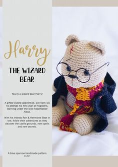 a crocheted harry the wizard bear sitting on top of a white bed sheet