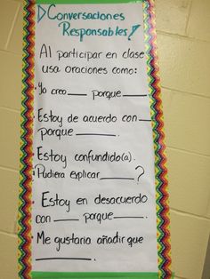 a bulletin board with spanish words on it in the classroom for students to read and write