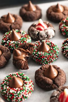 there are many cookies that have been decorated with icing and sprinkles