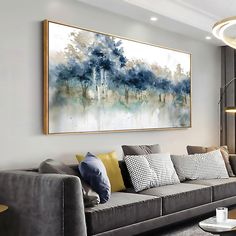 a living room filled with furniture and a large painting on the wall above it's couch