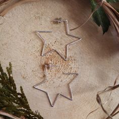 A little bit of the night sky for your ears! To go along with the moon hoop earrings, I was asked to make some stars as well. These sterling silver hoops are about 1.5 inches wide and about 1.5 inches tall. Wonderful every day earrings that will go with your favorite outfit! Custom made to order designs such as these star hoop earrings will take me about 1-2 weeks to create before they are mailed off to you. Celestial Sterling Silver Hoop Earrings With Star Charm, Celestial Star-shaped Hoop Earrings For Everyday, Sterling Silver Celestial Hoop Earrings With Star Charm, Everyday Celestial Star Hoop Earrings, Star-shaped Hoop Earrings For Everyday, Celestial Star-shaped Hoop Earrings For Gift, Celestial Sterling Silver Star Hoop Earrings, Sterling Silver Star-shaped Hoop Earrings, Hypoallergenic Star-shaped Sterling Silver Hoop Earrings