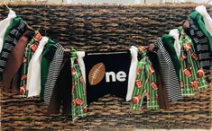 a football themed banner hanging from a wicker basket